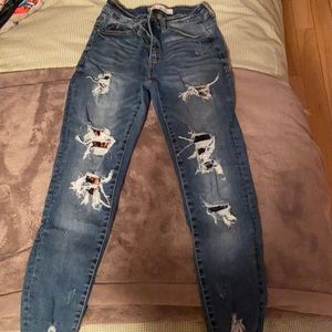KanCan ripped cheetah patched jeans